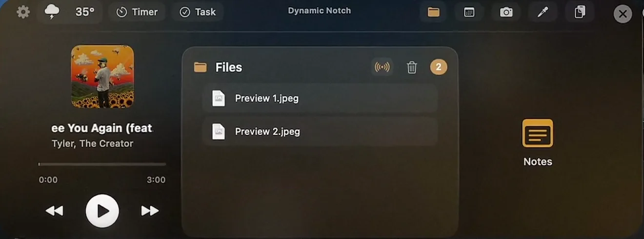 Two screenshots parked in the Dynamic Notch file tray, with AirDrop and clear buttons in the tray header